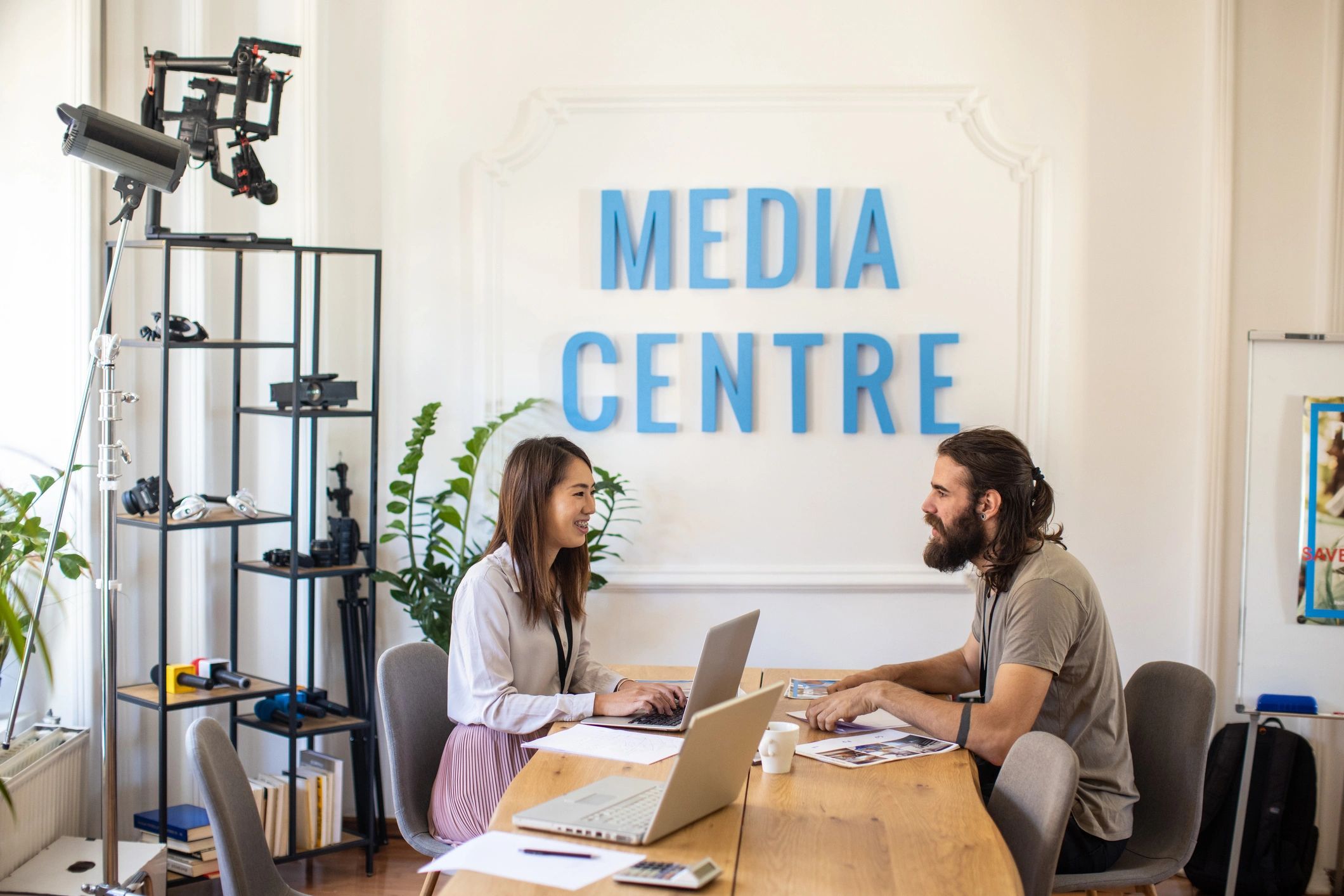 Agent and client discussing itinerary at a desk