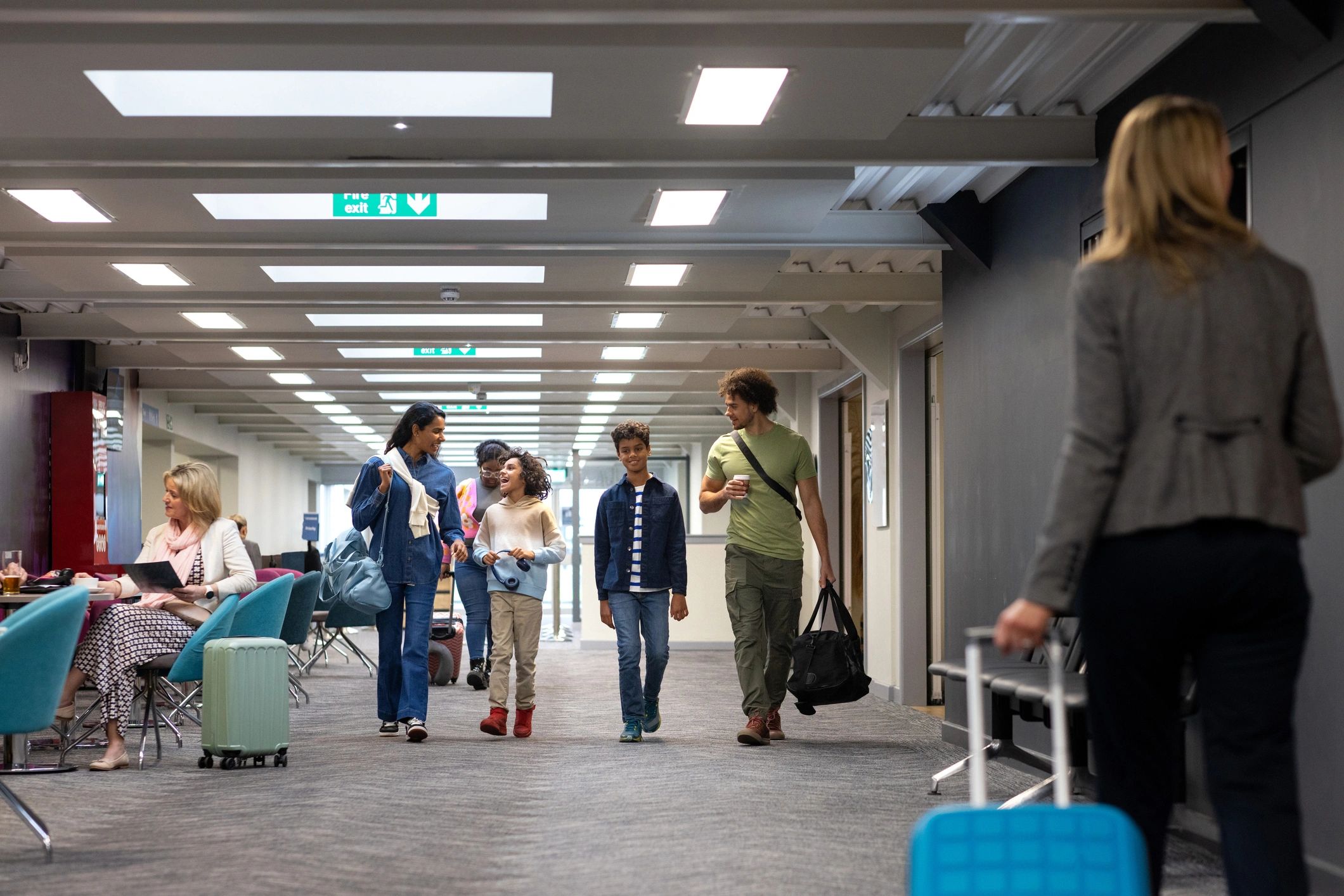 Family walking through an airport terminal