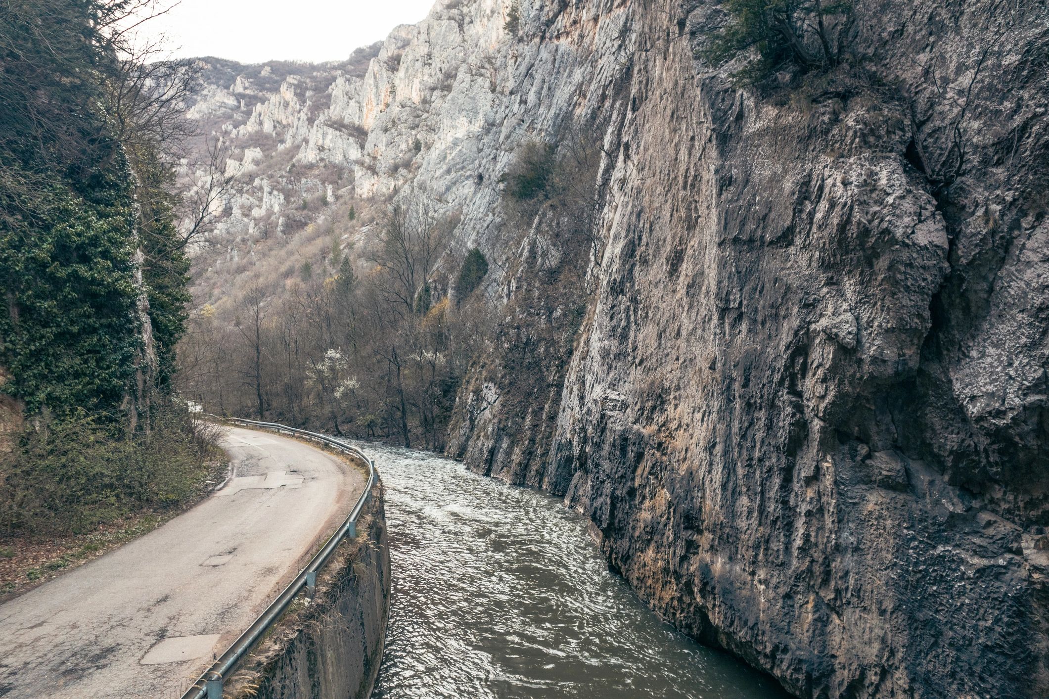 Canyon road beside a fast flowing river